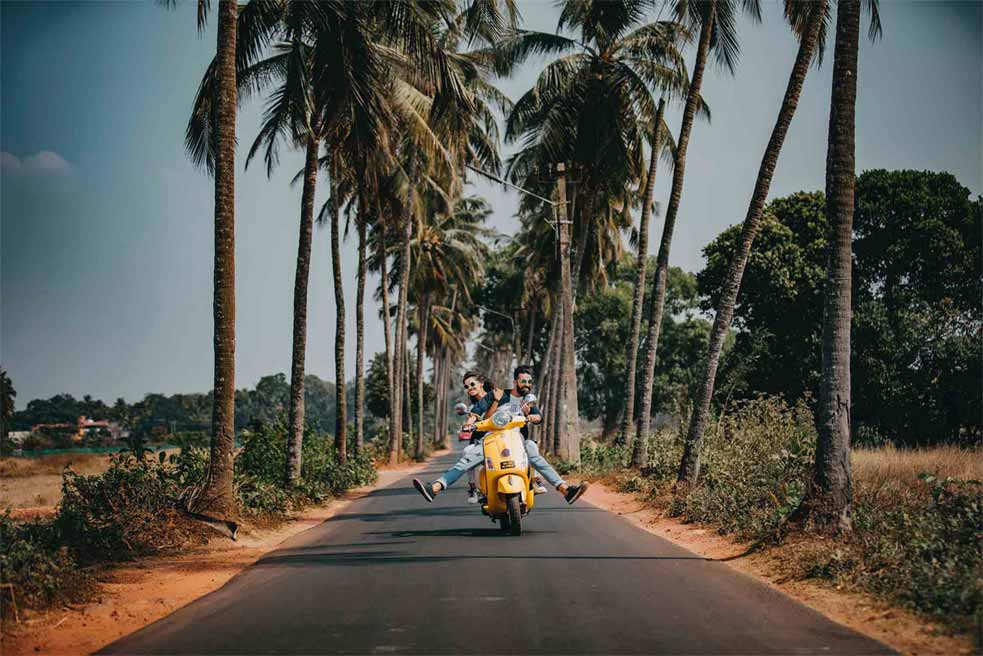 A couple out on a tour around Medellin Colombia in a scooter 